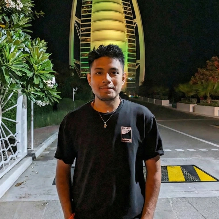 Neeraj, looking at the camera.